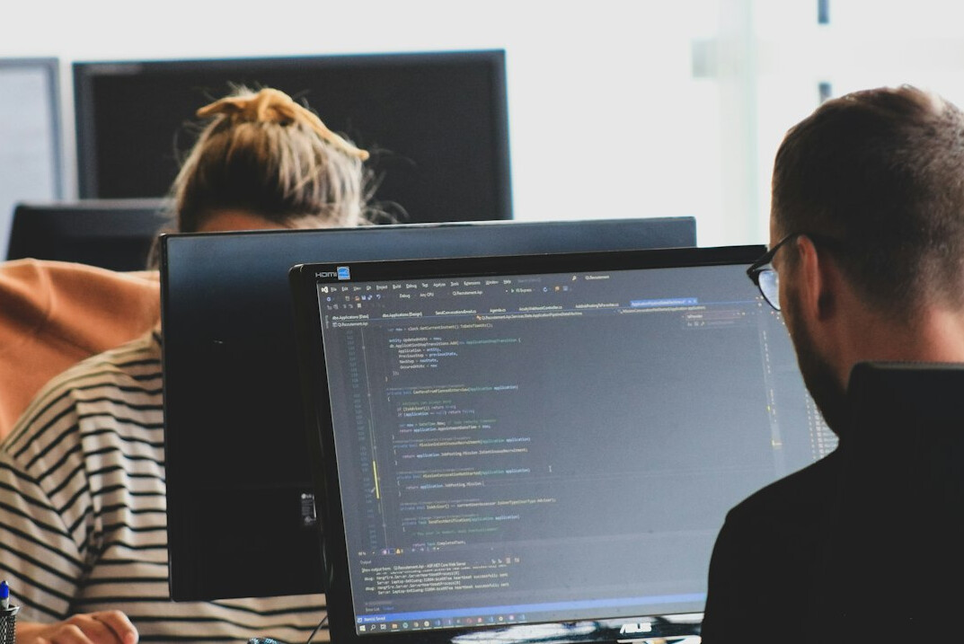 software developers coding together