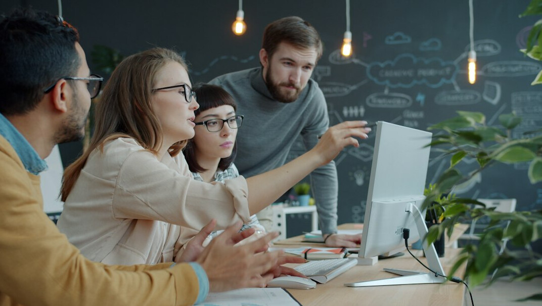 business team reviewing code