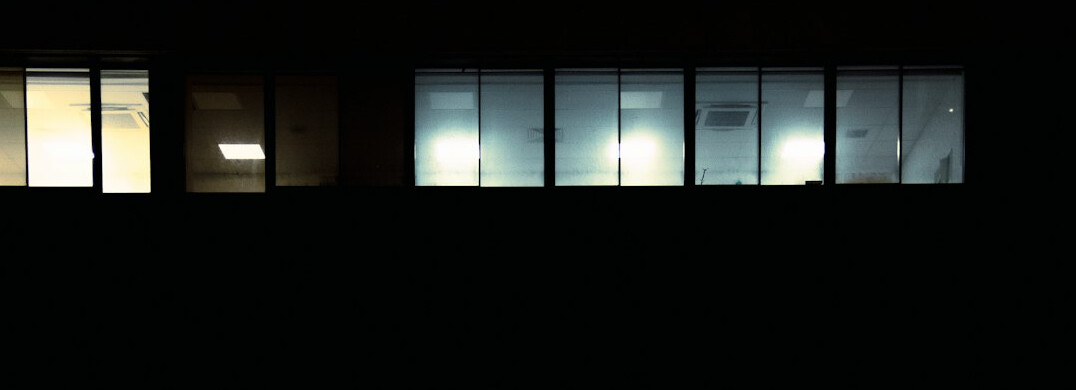 Source code displayed on a monitor in a dark office