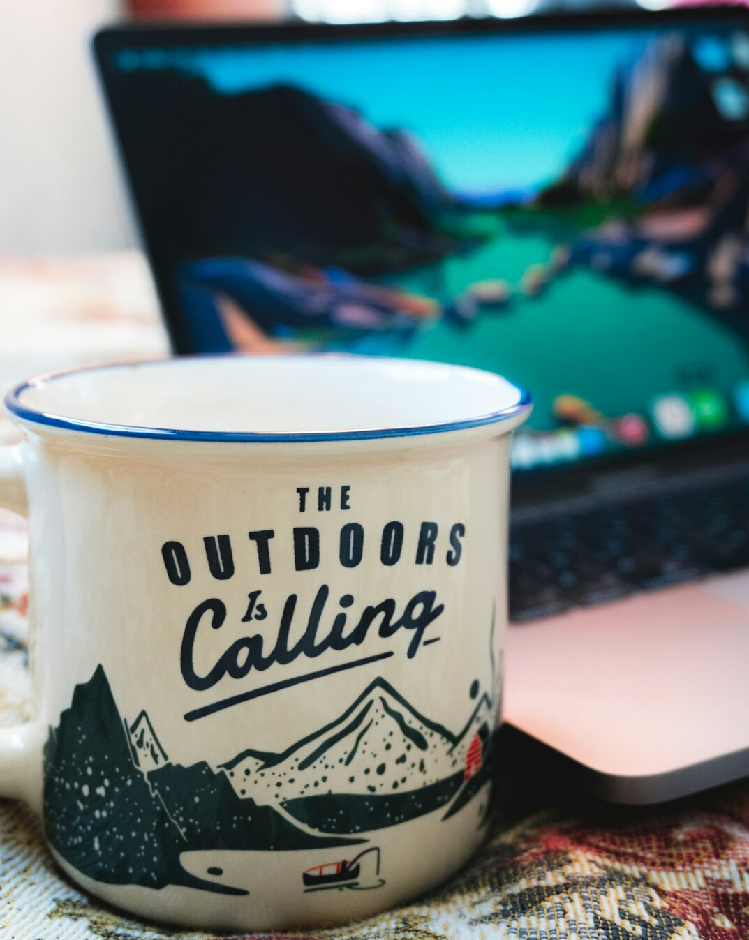 Laptop with code and a coffee mug